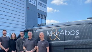 Team outside with van