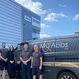 Team outside with van